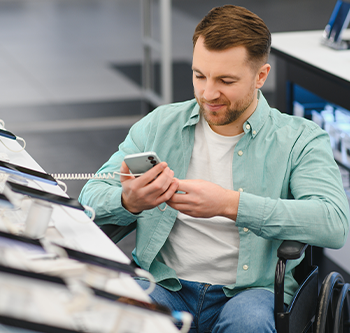 man looking at cell phones to buy