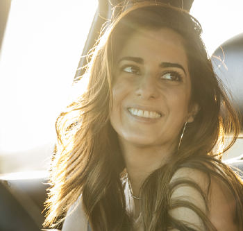 Woman smiling in a car