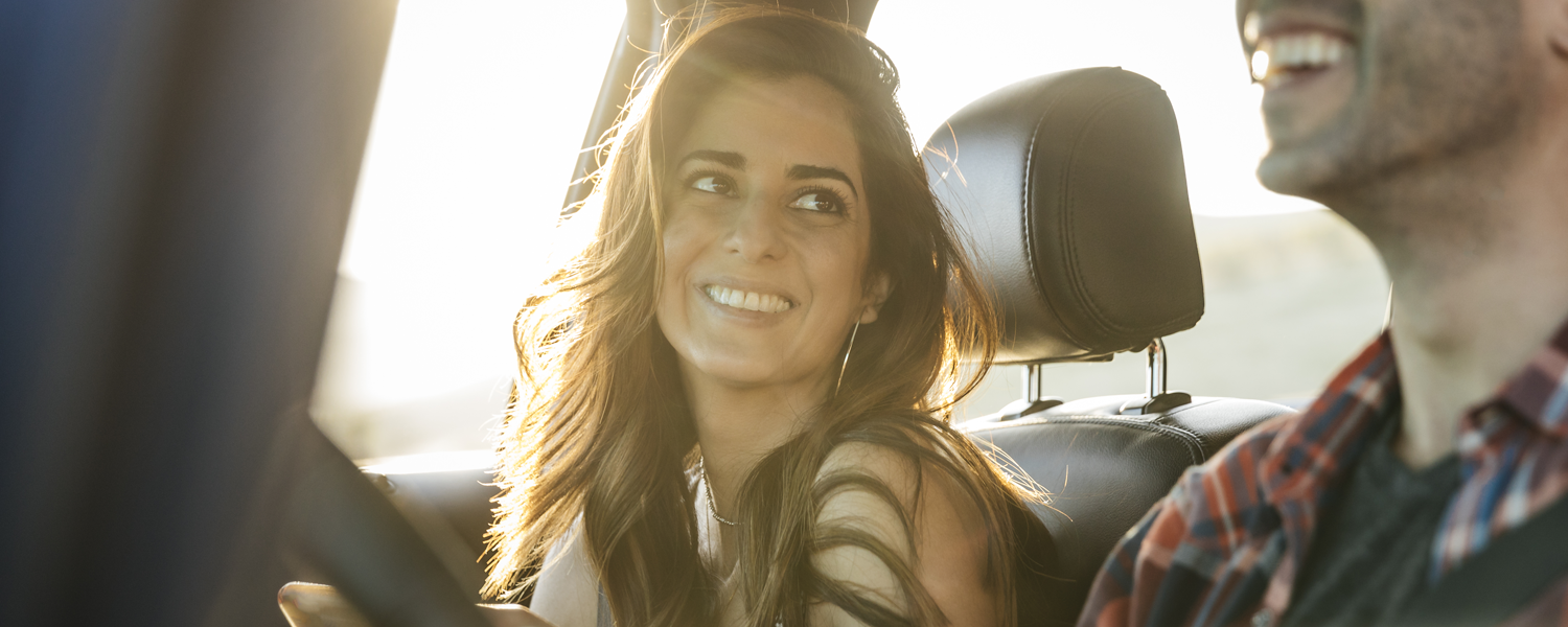 Woman smiling in a car