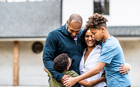 Family smiling and hugging