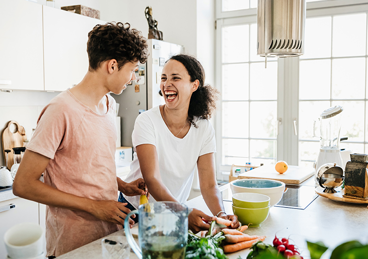 Two people cooking together