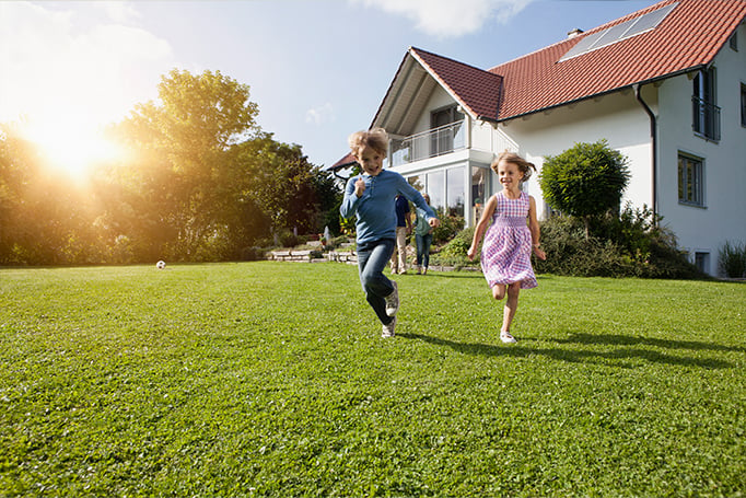 Children running in their yard