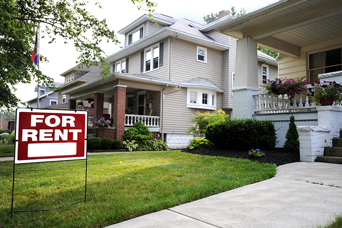 For Rent sign in front of a rental property